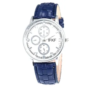 Detail view of business quartz watch with blue leather strap and three-dial silver case