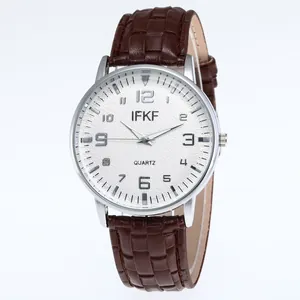 Classic men's quartz watch with a brown leather strap and a silver round case on white background
