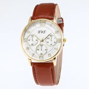 Classic men's business watch with brown leather strap and gold case on white background