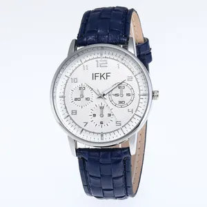 Business men's quartz watch with blue leather strap and silver case on white background