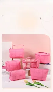 Detail of hot pink travel toiletry bag set with quilted texture and large capacity