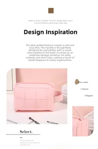Detail of pink quilted cosmetic bag with handle showing fabric texture and design