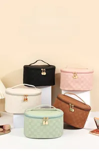 Stack of checkerboard makeup bags in five colors with dual zippers and handles