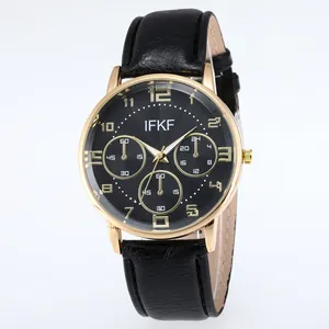 Detailed close-up of IFKF luxury gold watch face with black textured dial and leather strap