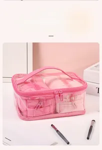 Pink quilted travel organizer set with transparent top and internal storage bags