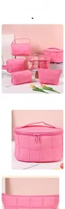 Pink quilted travel makeup bag set with top handle and transparent window sections