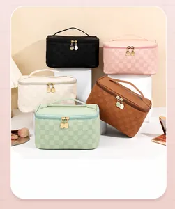 Detail of checkered PU leather makeup bags with gold zippers and handles in five colors