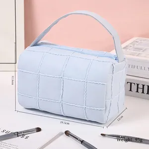 Quilted light blue checkered makeup bag with handle for travel and daily storage