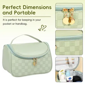 Large pale green waterproof cosmetic bag with woven texture and gold zipper detail