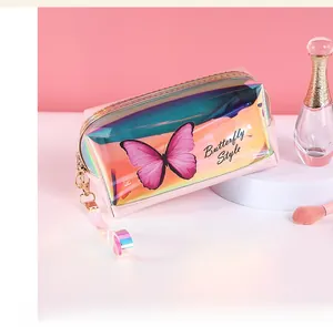 Detail of laser iridescent makeup bag with butterfly pattern and metallic zipper