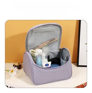 Close-up of lavender travel pouch with woven texture and open top showing large capacity