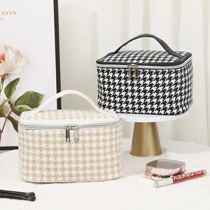 Chic houndstooth checkered makeup bags in black and beige with top handle and dual zippers