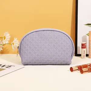 Portable lavender PU leather semicircular cosmetic bag with woven texture and gold zipper
