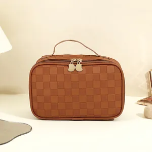 Portable brown checkerboard PU makeup bag with top handle and dual zippers