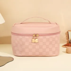Pink PU leather makeup bag with woven checkerboard pattern and cat shaped gold zippers