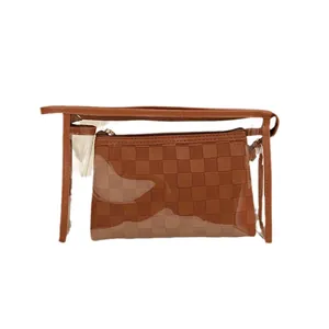 Brown checkered travel toiletry bag set with transparent PVC outer bag and inner pouch