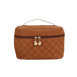 Caramel brown PU leather travel toiletry bag with checkered pattern and top handle