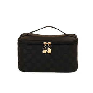 Waterproof black PU leather vanity case with checkerboard embossing and gold metal zippers