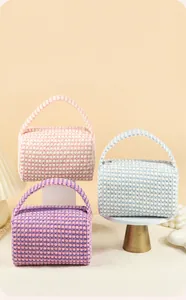 Detailed view of woven checkered makeup bags in pink, blue, and purple with handles