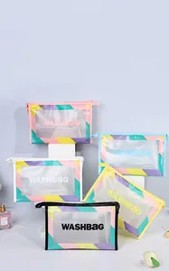Close-up of waterproof frosted PVC washbags with colorful trim and WASHBAG text