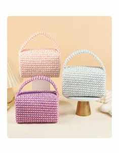 Detailed close-up showing textured knit fabric and zipper of stylish checkered cosmetic bags