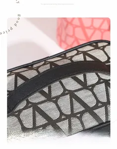 Close-up of the geometric V-pattern jacquard fabric and durable black carrying strap