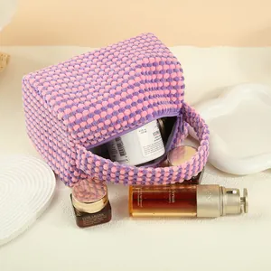 Pink and purple checkered waffle fabric pillow cosmetic bag with a convenient handle