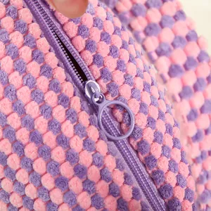 Chic quilted bubble cosmetic bag in pink and purple with large ring zipper pull