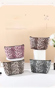 Detailed close-up of leopard print PU leather cosmetic bags in various stylish colors