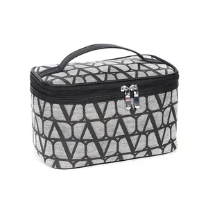 Portable V-pattern travel makeup bag with leather handle and large capacity storage