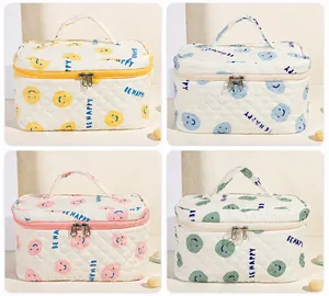 Borse da toilette in cotone trapuntato in quattro colori con motivi smileys