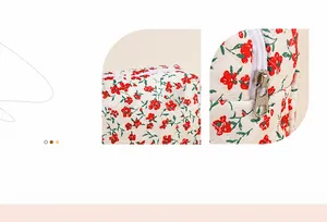 Detail of quilted floral toiletry bag with red flower patterns and silver metal zipper