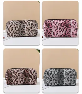 Detailed comparison of leopard print makeup bags in brown, pink, dark tan, and silver grey