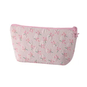 Borsa trucco floreale con trama 3D, motivi floreali rosa e cerniera a stella