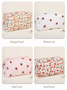 Detailed grid view of quilted floral and persimmon print makeup bags with metal zippers