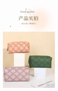 Detail of floral PU makeup bags in pink, olive and purple with sturdy handles