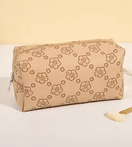 Detail of floral embossed PU leather makeup bag with silver zipper and large capacity