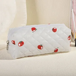 Quilted floral makeup bag with red tomato print and white diamond stitch zip pouch