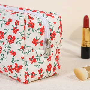 Floral quilted makeup bag with large capacity for travel and cosmetic storage