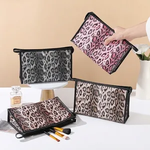 Stylish leopard print cosmetic bags in four colors with portable handles and zippers