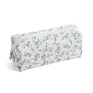 Floral quilted makeup bag with purple flower pattern and silver zipper closure