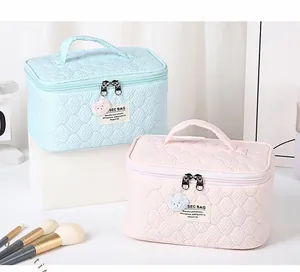 Quilted bubble texture cosmetic bags in blue and pink with cute bear zipper pulls