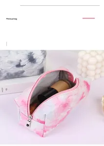 Quilted cosmetic bags with heart patterns in pink tie-dye and grey textures for storage