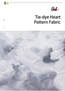 Detail of blue tie-dye makeup bag fabric with embossed heart pattern stitching