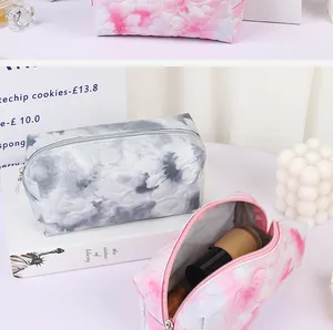 Detailed macro view of heart-quilted pattern and smooth zipper on large makeup bag