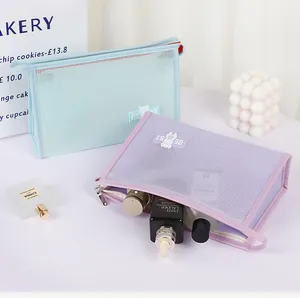 Detail of mesh toiletry bag showing semi-transparent capacity with cosmetics inside