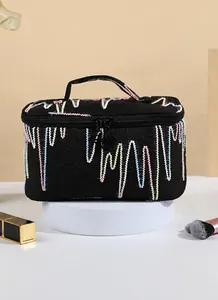 Detail of large capacity makeup bag with colorful wave embroidery and top handle