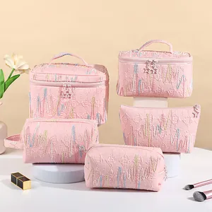 Set de neceseres rosas con diseño de ondas y cremalleras en forma de estrella