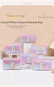 Macro view of holographic laser makeup bags with chenille letter embroidery
