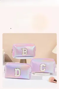 Close-up of holographic PU leather makeup bag with chenille letter embroidery